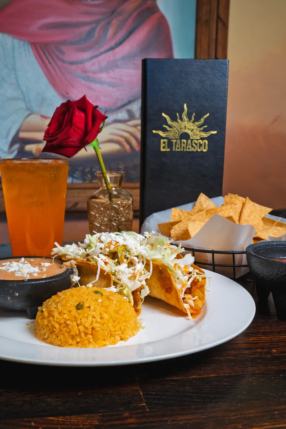 A flautas plate with Mexican rice and cotija cheese